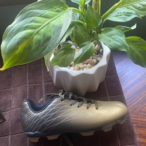 Gold and black unisex cleats. Kids size 12.